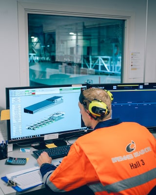 A worker checks the temperature of the breeding tanks