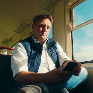 Thomas Bonk sitting in the train - way to his work