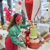  Maria Quirino de Almeida works on one of her sweet creations.