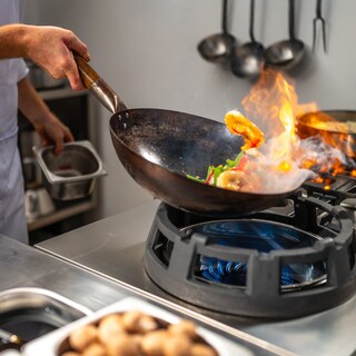 Food is being fried in a professional kitrchen