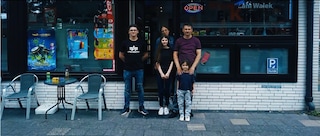 The Erkin family in front of their kiosk in Herten